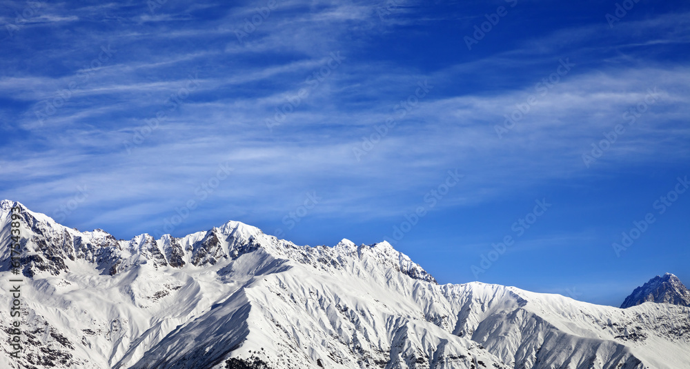 Panoramic view on winter mountains at sun winter day. View from ski lift on Hatsvali, Svaneti region of Georgia. Caucasus Mountains.