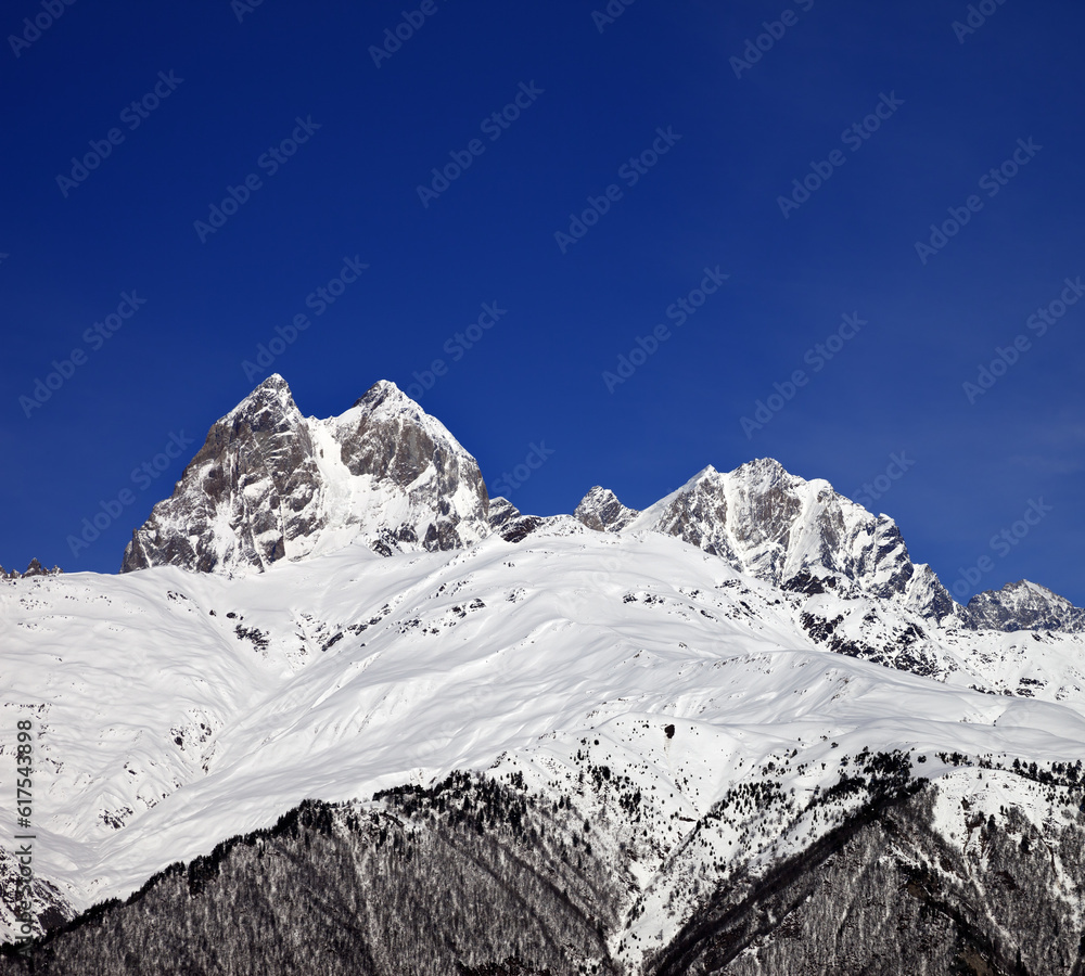 Mount Ushba in winter at sun day. Caucasus Mountains. Svaneti region of Georgia.
