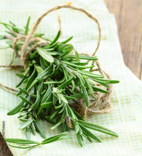Fresh organic rosemary on a wooden table