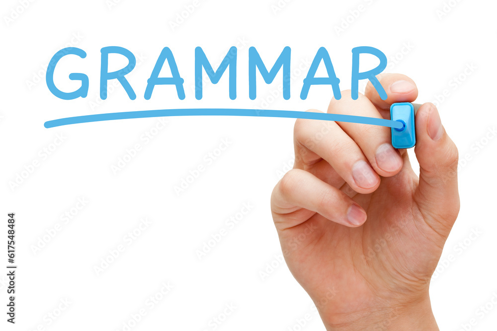 Hand writing Grammar with blue marker on transparent glass board. Hand writing Grammar with blue marker on transparent glass board.