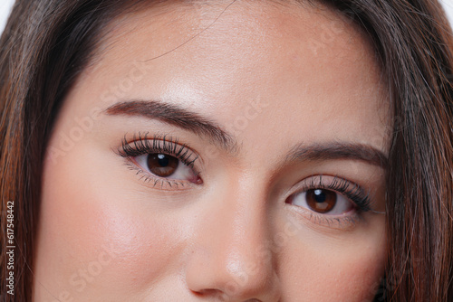 close up view of young woman eye looking at camera