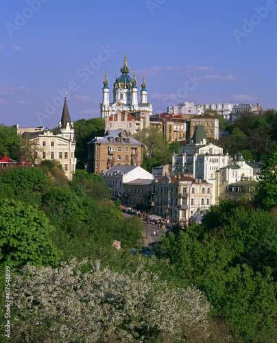 Andriyivskyy Descent and the Saint Andrew's Church with blossom trees in foreground. Kiev.