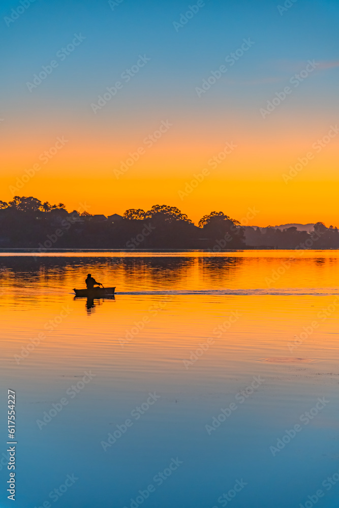 Sunrise at the waterfront in orange and blue Sunrise at the waterfront in orange and blue