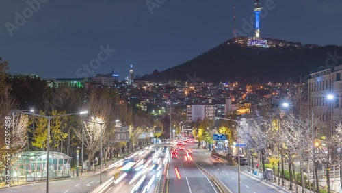 Seoul South Korea time lapse 4K, city skyline night timelapse at Itaewon view from Noksapyeong Bridge in autumn photo