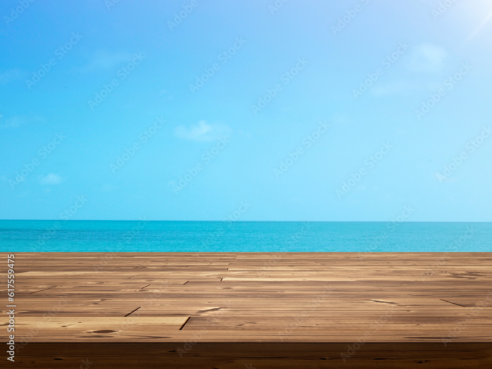 Empty wooden table with sky and sea as background