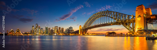 Panoramic image of Sydney, Australia with Harbour Bridge during twilight blue hour.