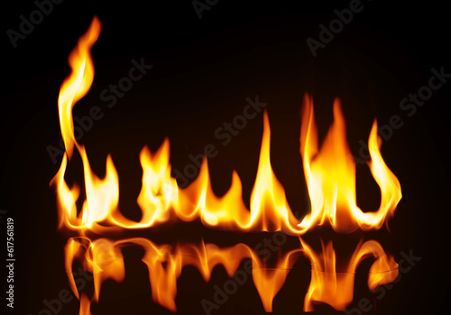 A strip of fire on the reflecting surface. On a black background.