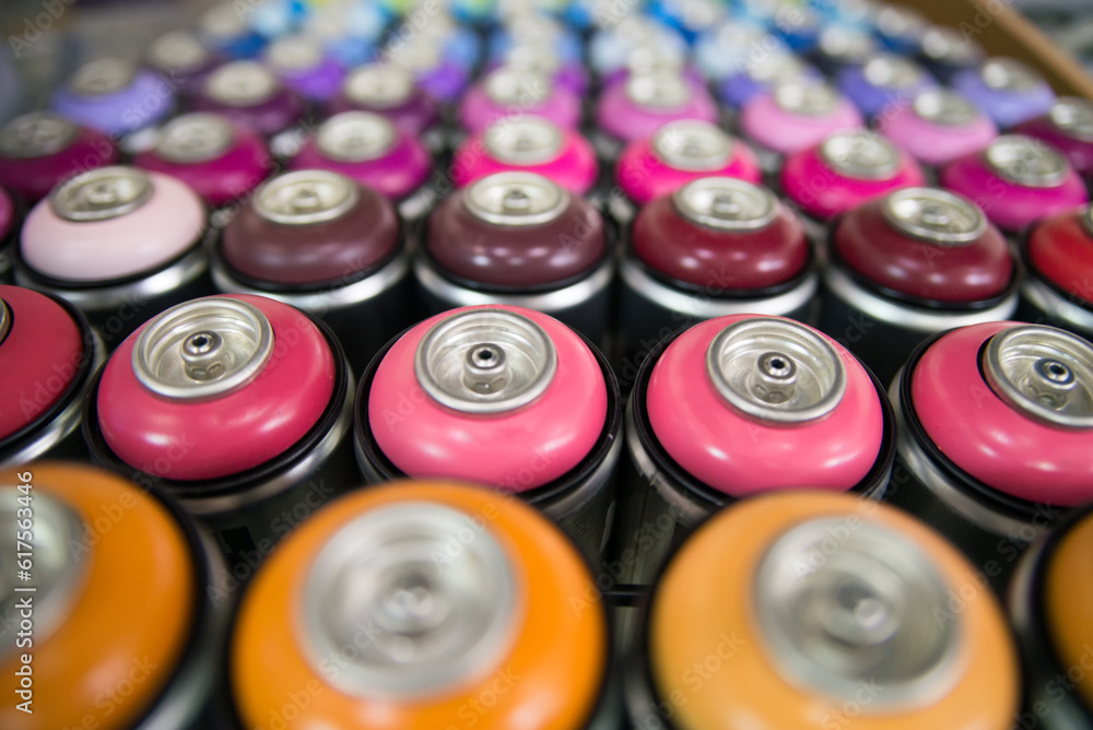 colorful cans of paint stand rows on a shelf colorful cans of paint stand rows on a shelf