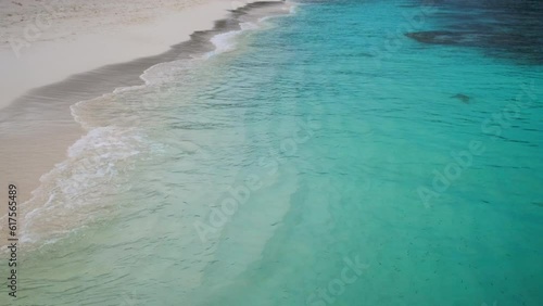 A Maldives Beach With White Sand And Blue Water photo