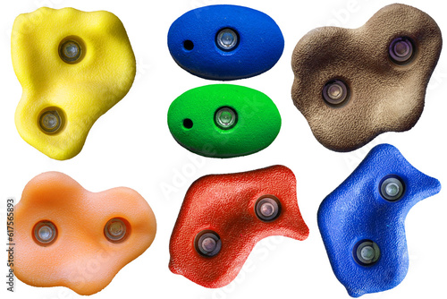 Set of grips different colors and shapes for climbing wall isolated on white background / set collection of various artificial climbing holds with clipping path / bouldering extreme sport