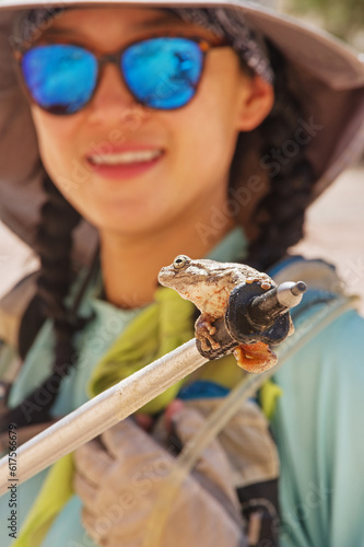 Woman Looks At Canyon Tree Frog photo