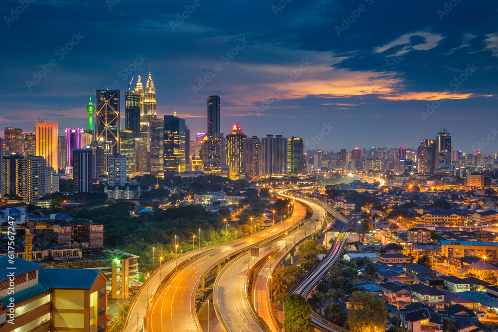 Cityscape image of Kuala Lumpur, Malaysia during sunset.