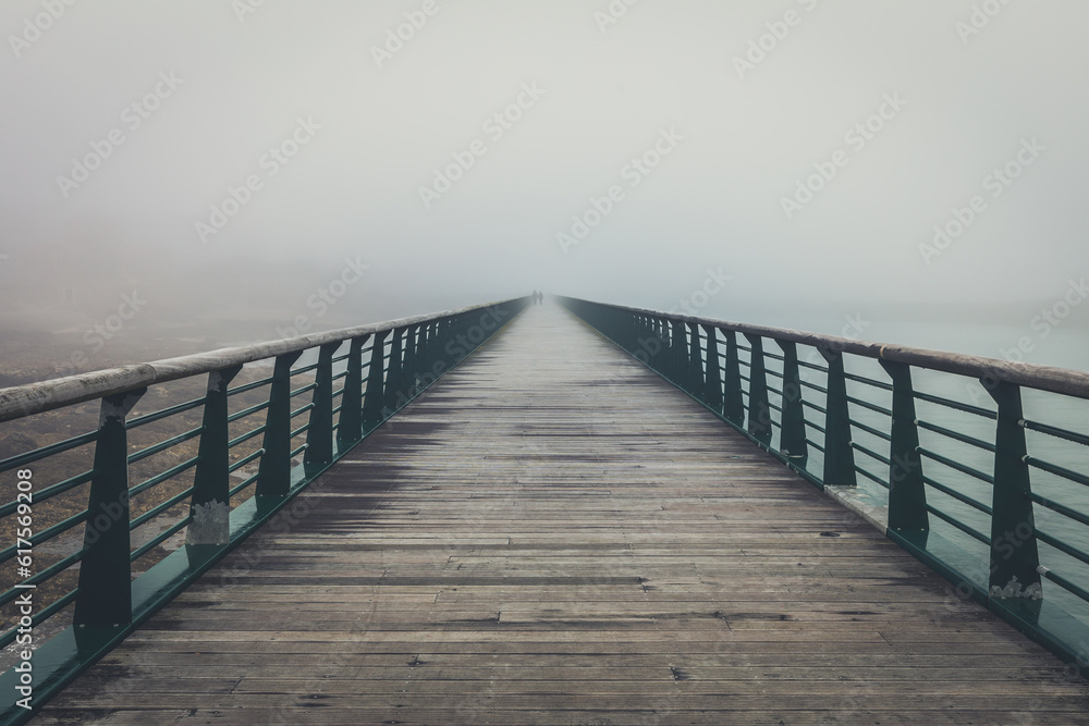 Fototapeta premium Fog on the jetty bridge of la Chaume (Les Sables d'Olonne, France)