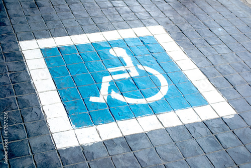 High angle view of a handicap icon at a parking spot in railway station outdoors. photo