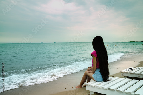 Summer girl with very long hair looking into the distance on the beach on the Black Sea © Designpics