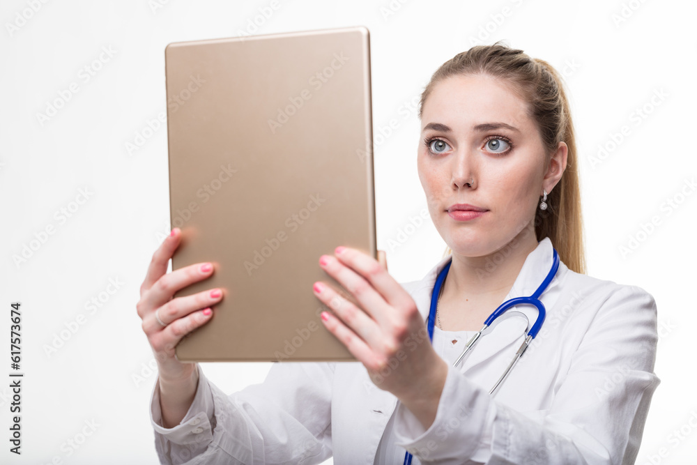 young medical doctor, woman checking some data or exam test results in her large digital tablet because this is a modern era and there aren't plates for x-ray no more young medical doctor, woman checking some data or exam test results in her large digital tablet because this is a modern era and there aren't plates for x-ray no more