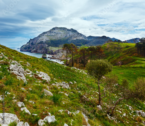 Spring sea coast lanscape with rocky cape and small bay  San Julian Beach  Liendo  Cantabria  Spain .