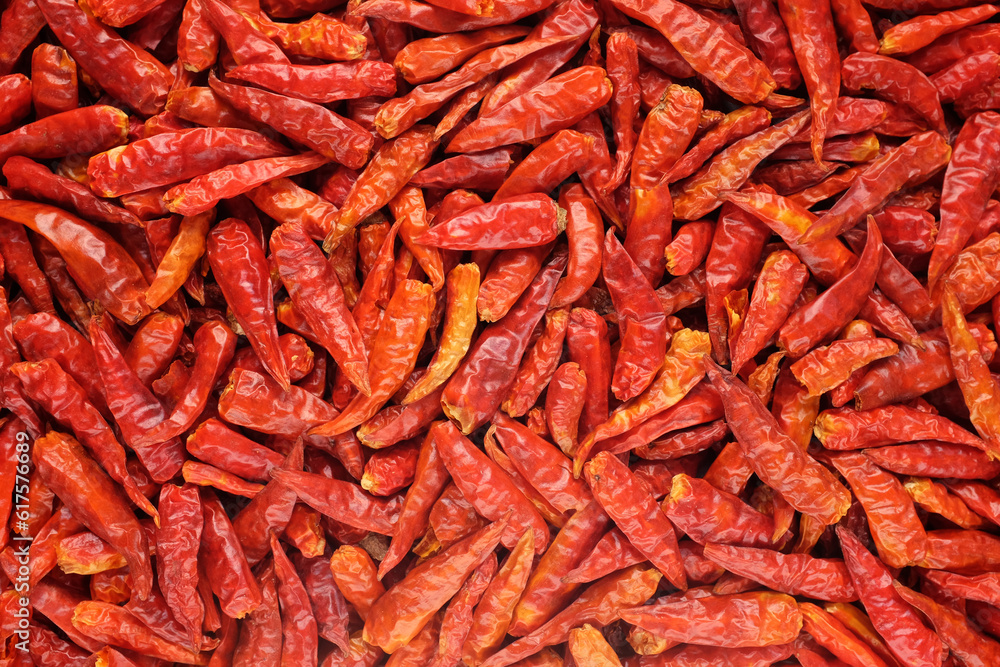 Dried spicy red birds eye chillis as an abstract background texture Dried spicy red birds eye chillis as an abstract background texture