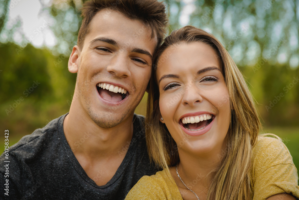Portrait of a young beautiful couple laughing Portrait of a young beautiful couple laughing