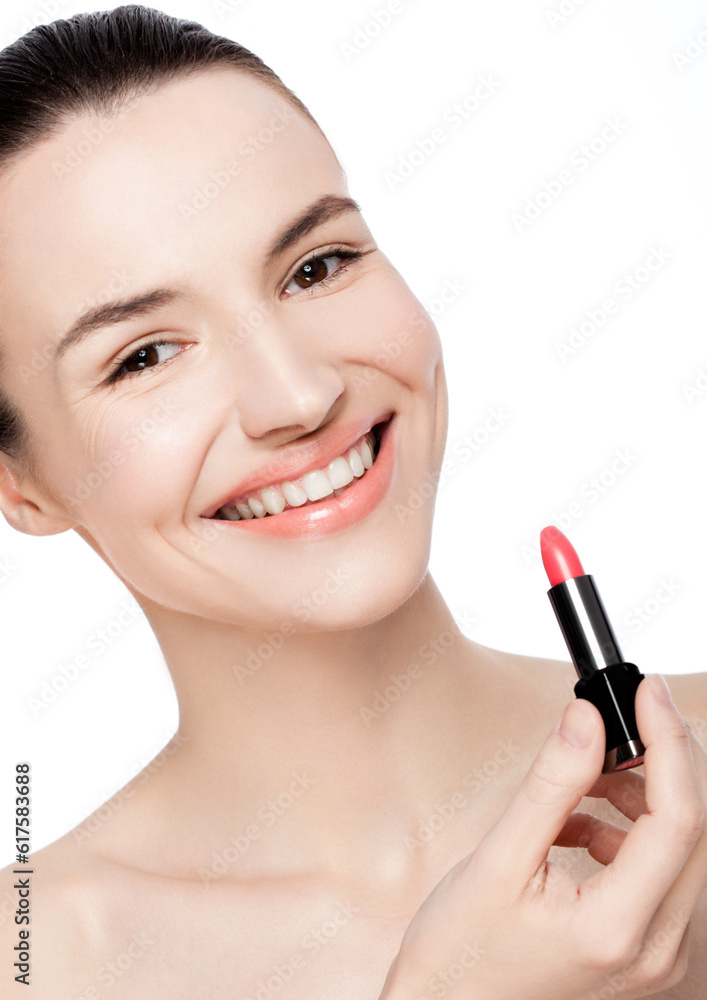 Beautiful model girl holding lipstick tube makeup on white background Beautiful model girl holding lipstick tube makeup on white background
