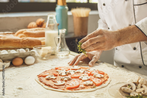 Bakery chef cooking bake in the kitchen professional making pizza