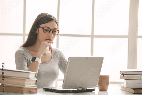Young woman study at home alone using digital device