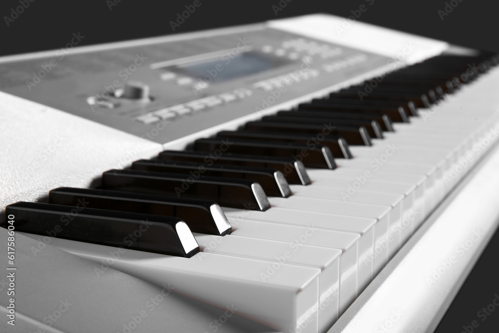Modern synthesizer on black background, closeup Modern synthesizer on black background, closeup