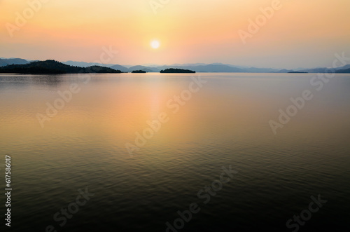 Beautiful landscape lake island and mountain range at sunset on the Kaeng Kra Chan Dam view point in National Park, Phetchaburi Province, Thailand