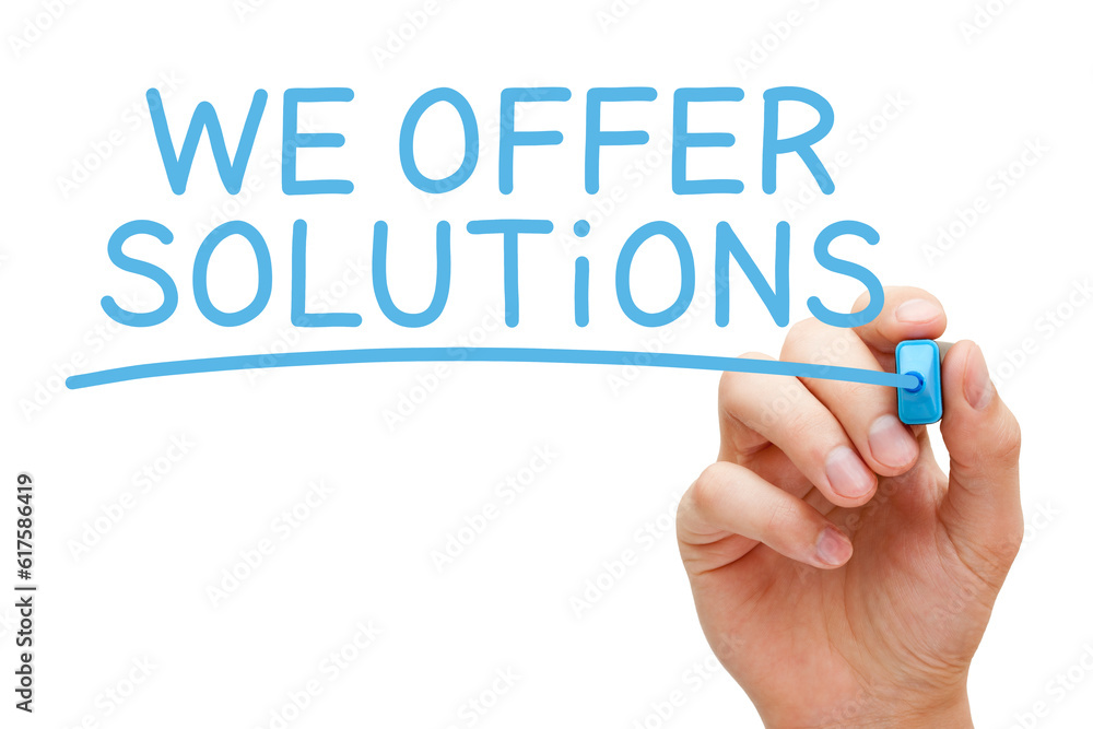 Hand writing We Offer Solutions with blue marker on transparent glass board. Hand writing We Offer Solutions with blue marker on transparent glass board.