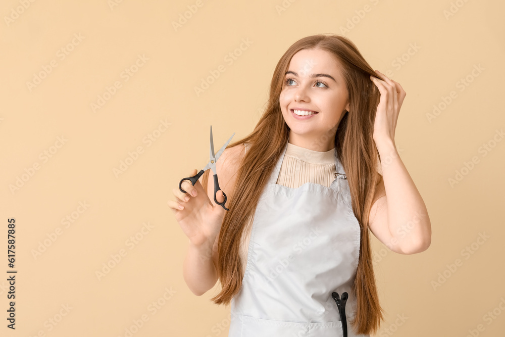 Female hairdresser with scissors on beige background Female hairdresser with scissors on beige background
