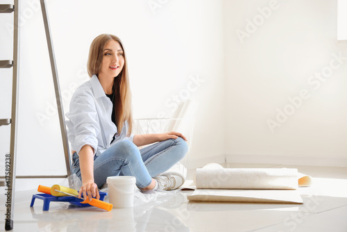 Young woman with supplies a...