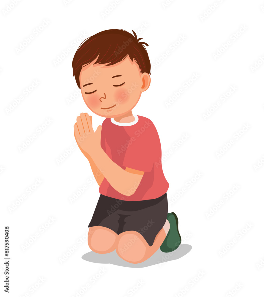 Cute little boy praying kneeling on his knee