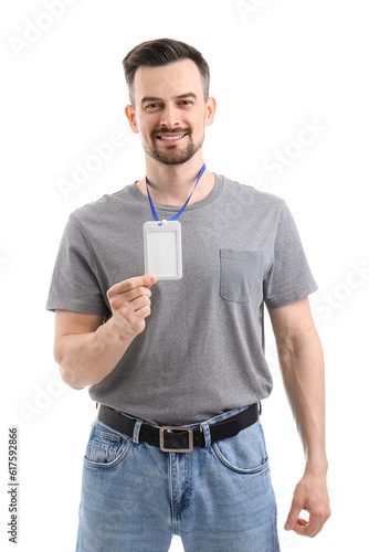 Young man with blank badge ...