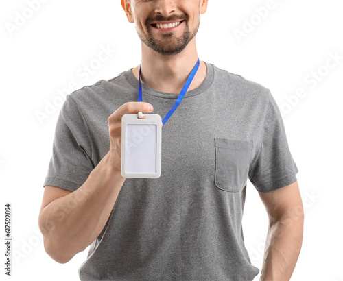 Young man with blank badge ...