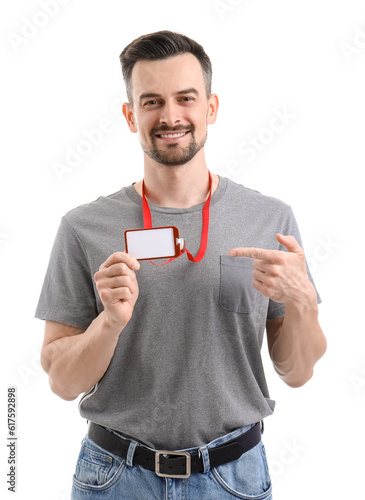 Young man pointing at blank...