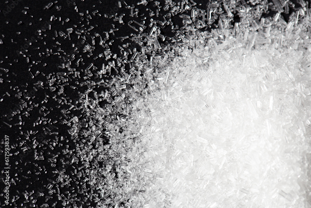 Top view pile of monosodium glutamate or seasoning powder on black background. selective focus Top view pile of monosodium glutamate or seasoning powder on black background. selective focus