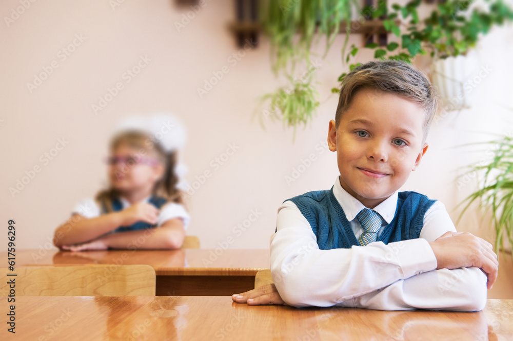 Happy schoolboy at school desk. Begining of learning. Happy schoolboy at school desk. Begining of learning.