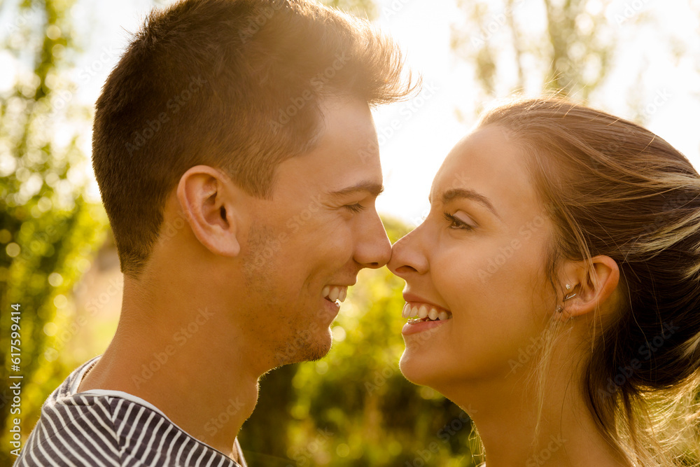 Portrait of a happy young couple in love and giving a kiss Portrait of a happy young couple in love and giving a kiss