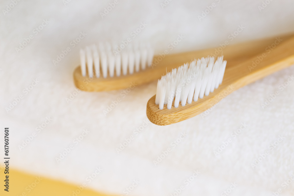 Bamboo tooth brushes on towels, closeup Bamboo tooth brushes on towels, closeup