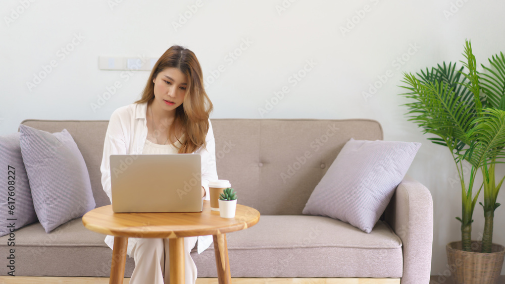 Business at home concept, Businesswoman using laptop to typing data and working at home office Business at home concept, Businesswoman using laptop to typing data and working at home office