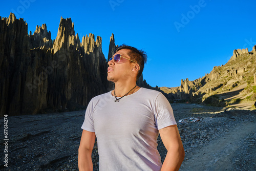 latin model with sunglasses posing in the mountains © Jhon