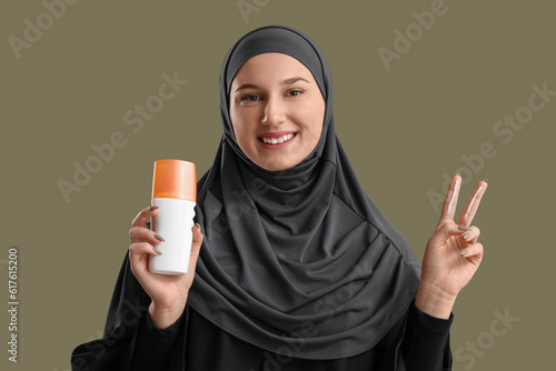 Young Muslim woman with sun...