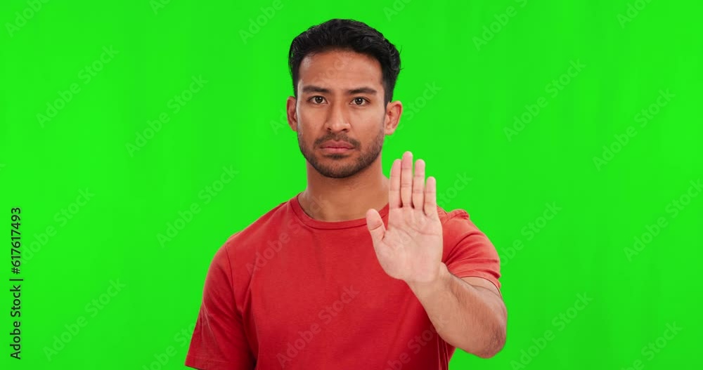 Green screen, hand and stop by man face in studio with no, reject or warning, sign language and boundaries on mockup background. Palm, emoji and portrait of asian male with ban, threat or protest Green screen, hand and stop by man face in studio with no, reject or warning, sign language and boundaries on mockup background. Palm, emoji and portrait of asian male with ban, threat or protest