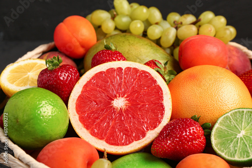 Bowl with different fresh fruits  closeup