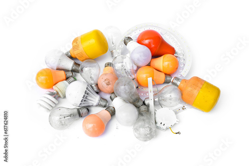 Fotografia Pile of garbage Used and disposed of light incandescent bulb and energy saving lamps (LED) expired from use isolated on white background