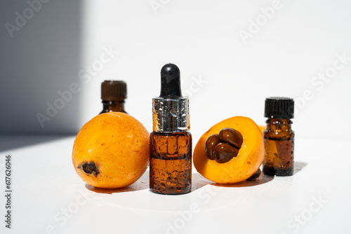 Essential oil of Japanese medlar. Nepole frutta Japanese medlar. Selective focus. photo