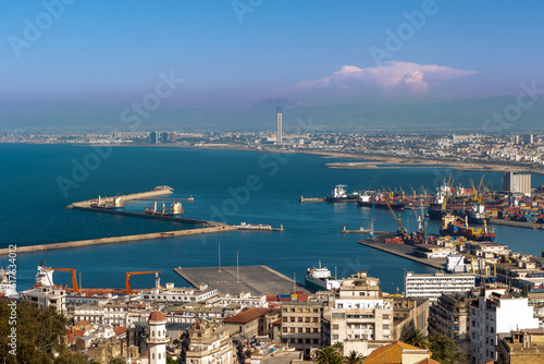 Beautiful panorama of the bay of Algiers, Alger, Algeria, with the industrial port and the Djamaa El-Djazaïr (English : Great Mosque) in the background. photo