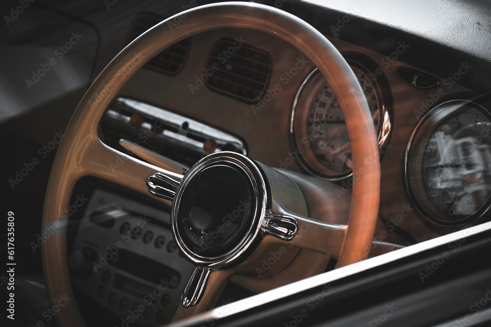 Close up on the steering wheel of a retro vehicle Close up on the steering wheel of a retro vehicle