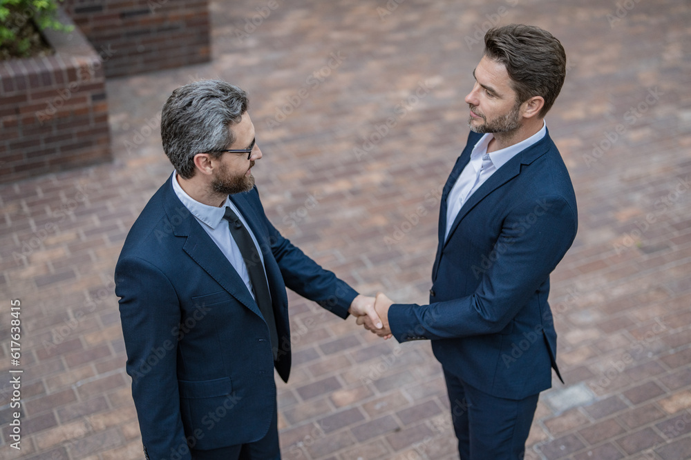 two business partners in suit dealing negotiation. photo of two business partners dealing two business partners in suit dealing negotiation. photo of two business partners dealing
