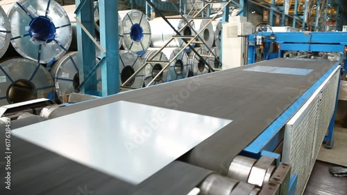 Metal or steel sheet cutting in a automated cutting machine in factory. photo